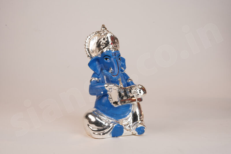 Silver Plated Ganesha holding Musical Instrument